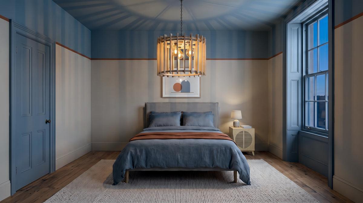 Render: a classic slate-blue bedroom at dusk lit by the Plyconcept Celeste pendant, with the Penelope bedside table in Natural birch plywood
