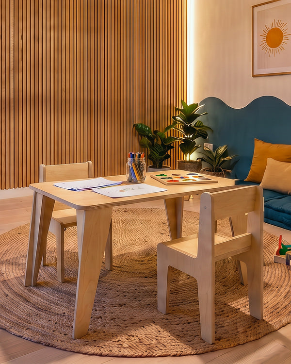 Render: the Sofi children's table and two chairs in Natural birch plywood, with drawing paper and crayons