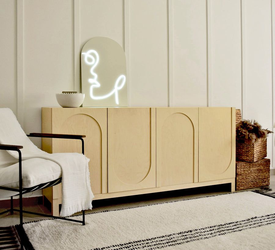 Birch plywood sideboard with four arched door panels in a living room