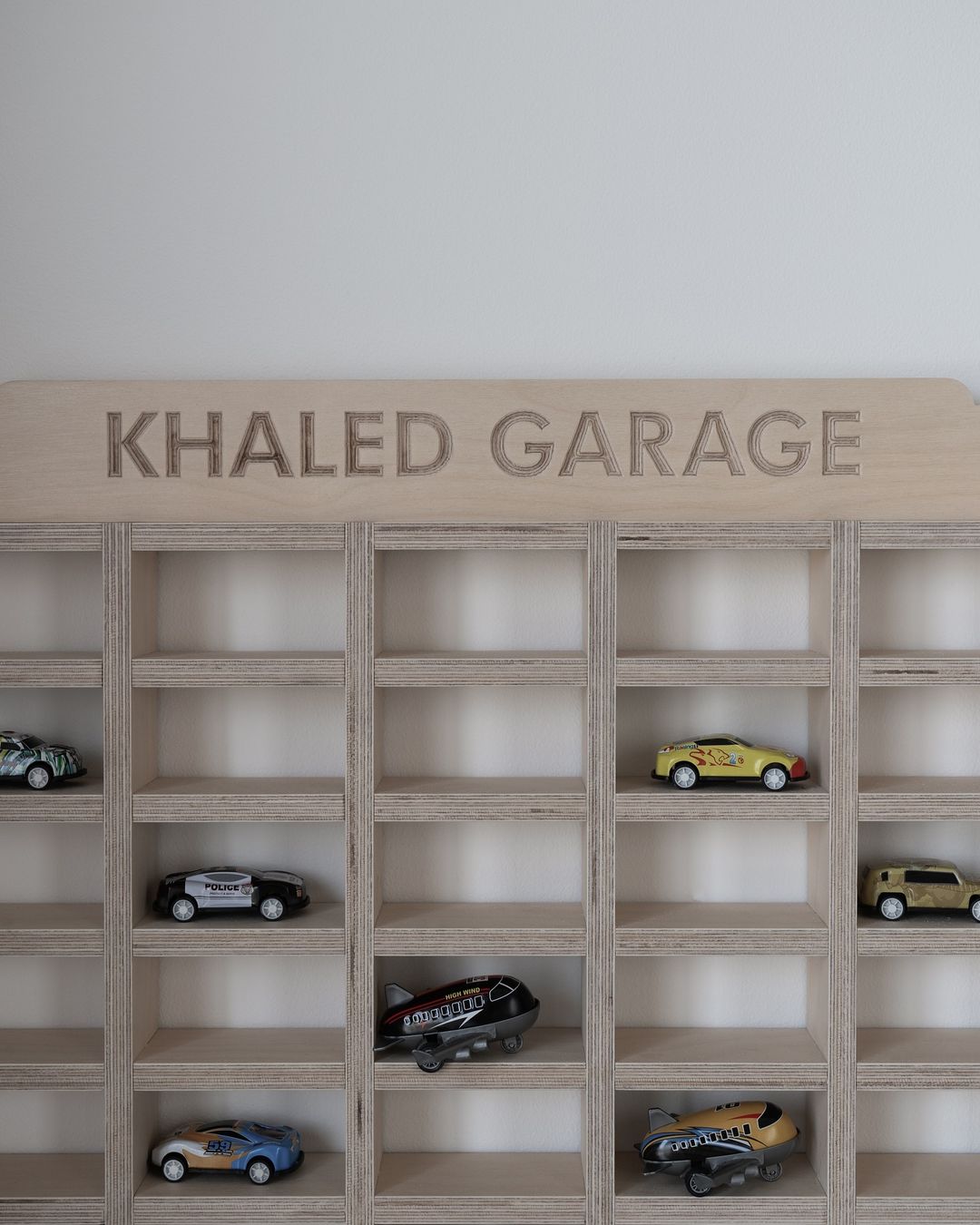Mini Car Wall Garage, a wall-mounted birch plywood toy car garage — view 3