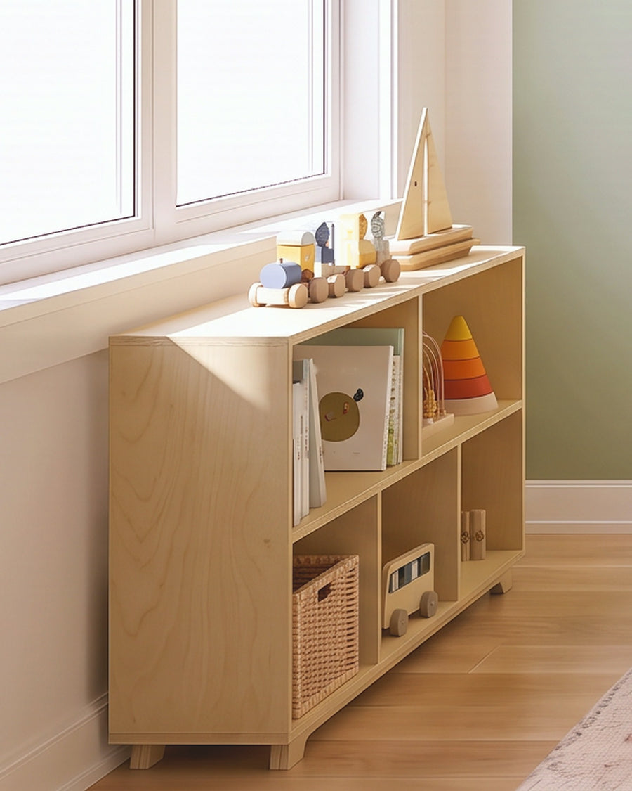 Render: the Sofi play shelves, toddler size, in Natural birch plywood, with wooden toys and picture books