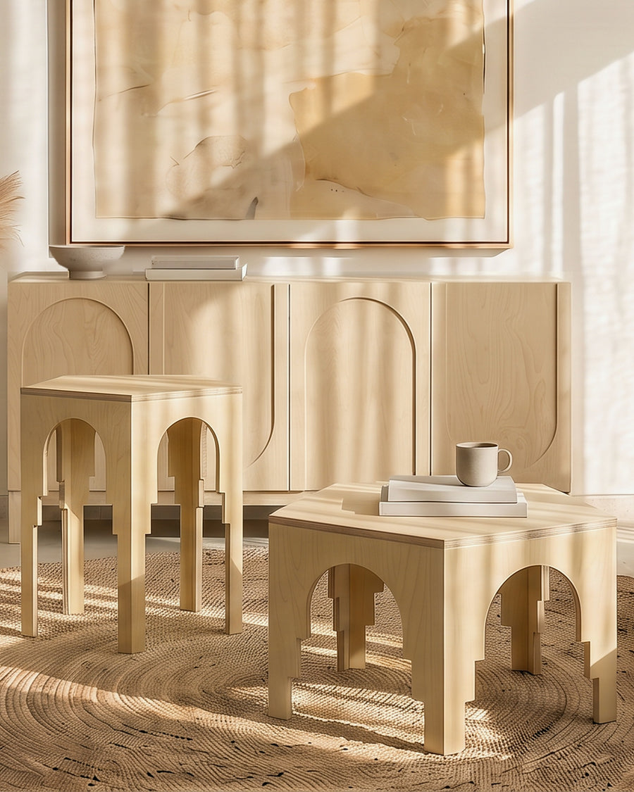 Render: the five-sided Luna tables, tall and low, in Natural birch plywood on a jute rug