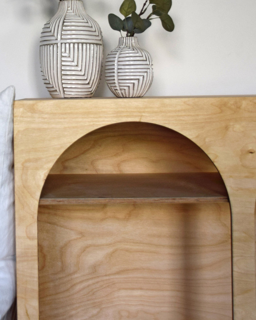 Close-up of an arched birch plywood sideboard made by Plyconcept, the grain and layered edges left to show
