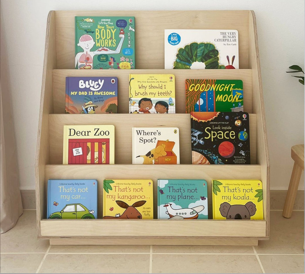 Children's wooden bookcase with multiple shelves filled with colorful picture books. made in dubai