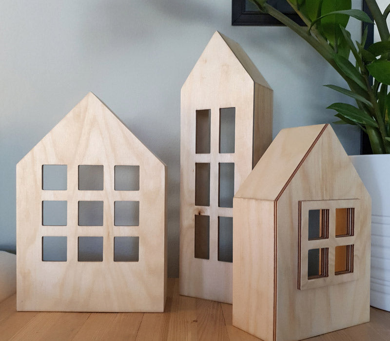 Heart Houses, a set of three birch plywood decorative houses, handmade in Dubai by Plyconcept